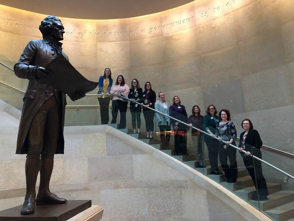 Dr. Patricia Winter and music therapy professionals pose for picture on Capitol Hill