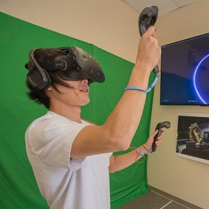 Radford University students explore a virtual world at the virtual reality lab