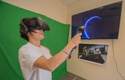 A student explores a virtual world at Radford University's Virtual Reality (VR) Lab