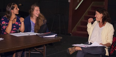 Lucinda McDermott talks with two students in her directors and playwrights class.