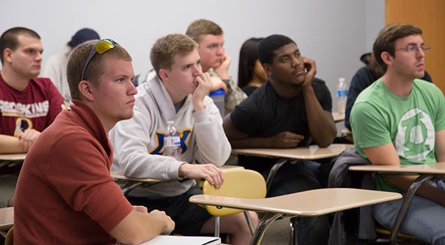 Students in Margaret Lisuzzo's Research Methods in Criminal Justice class listen to Heather Frost '01 in Cook Hall as part of the alumni teaching series