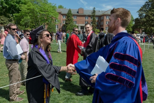ESPN's Marty Smith '98 greets a proud Spring 2015 graduate.