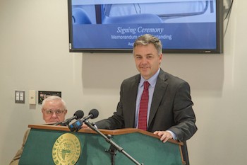 Chris Wade speaks at the signing of the Guaranteed Transfer Partnership Agreement on Aug. 28.