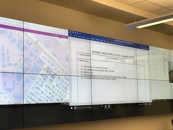Screens line the walls of the Emergency Operations Center