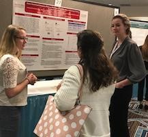 Morrgan Duncan, left, and Victoria Dunsmore, right, explain their research at SEPA.
