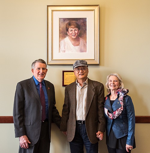 Pat and Nancy Artis with Radford University art professor Z. L. Feng (center) at the unveiling of the portrait of Janice Eisenhart.