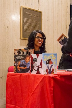 Ilyasah Shabazz signs books after giving her remarks.