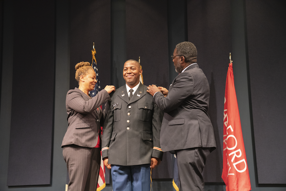 Sinclair's parents pinned him during the commissioning ceremony. 