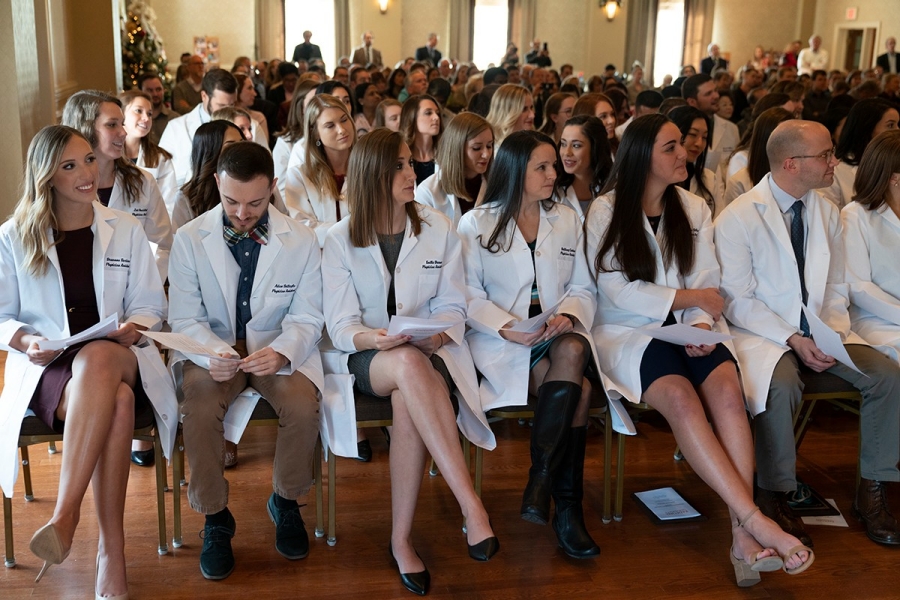 PA students prepare to read the Physician Assistant oath after receiving their white coats.