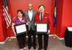 Presidential Service Award winners Donna Alley and David Horton with President Brian O. Hemphill (center).
