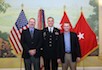 New US Army Brigadier General Jay Bienlien '90 is flanked by Peter Rasmussen '90 (left) and Arin Durr '94 (right) at his promotion ceremony March 23 at Patton Hall, Fort Meyer, VA