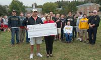 Phi Kappa Sigma alumni presenting a check to President Kyle for the Greek Leadership fund