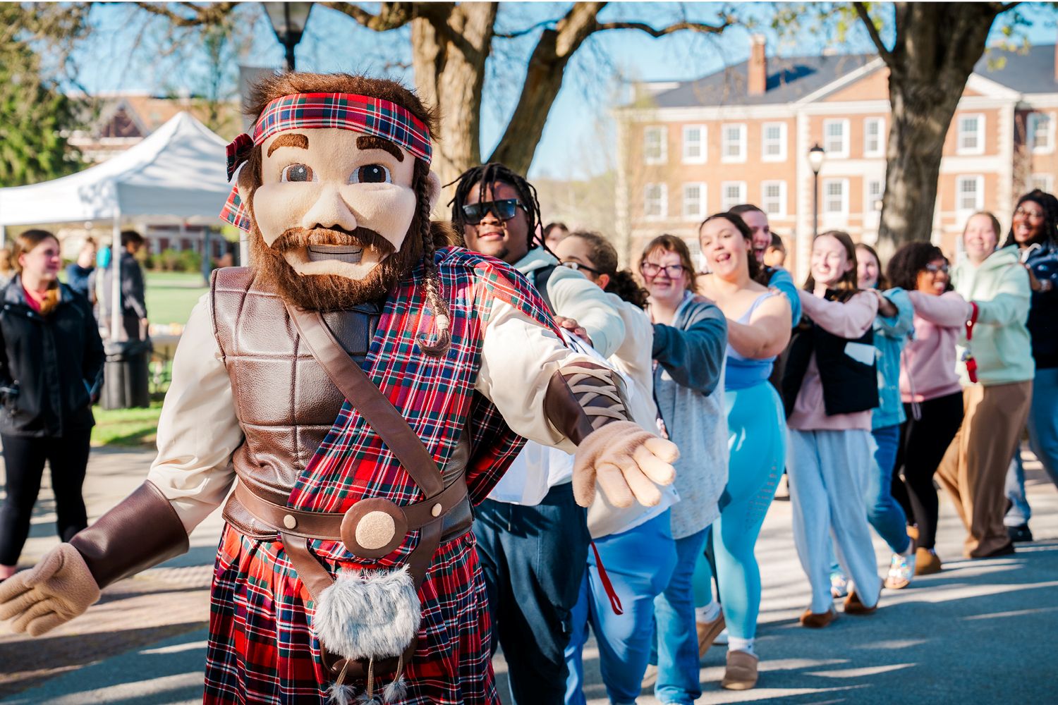 highalnder mascot dancing with students