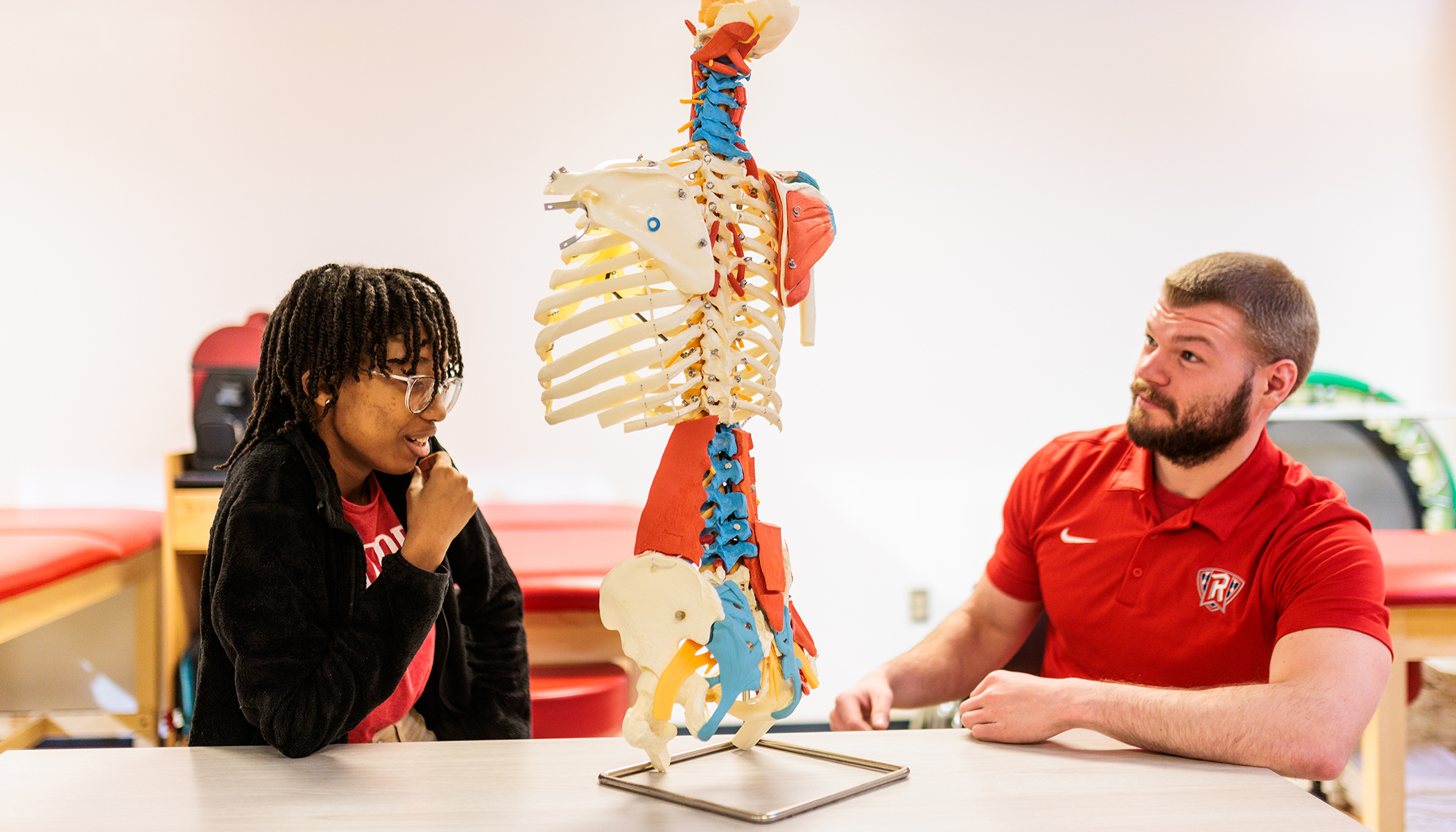 student and advisor looking at skeletal anatomy