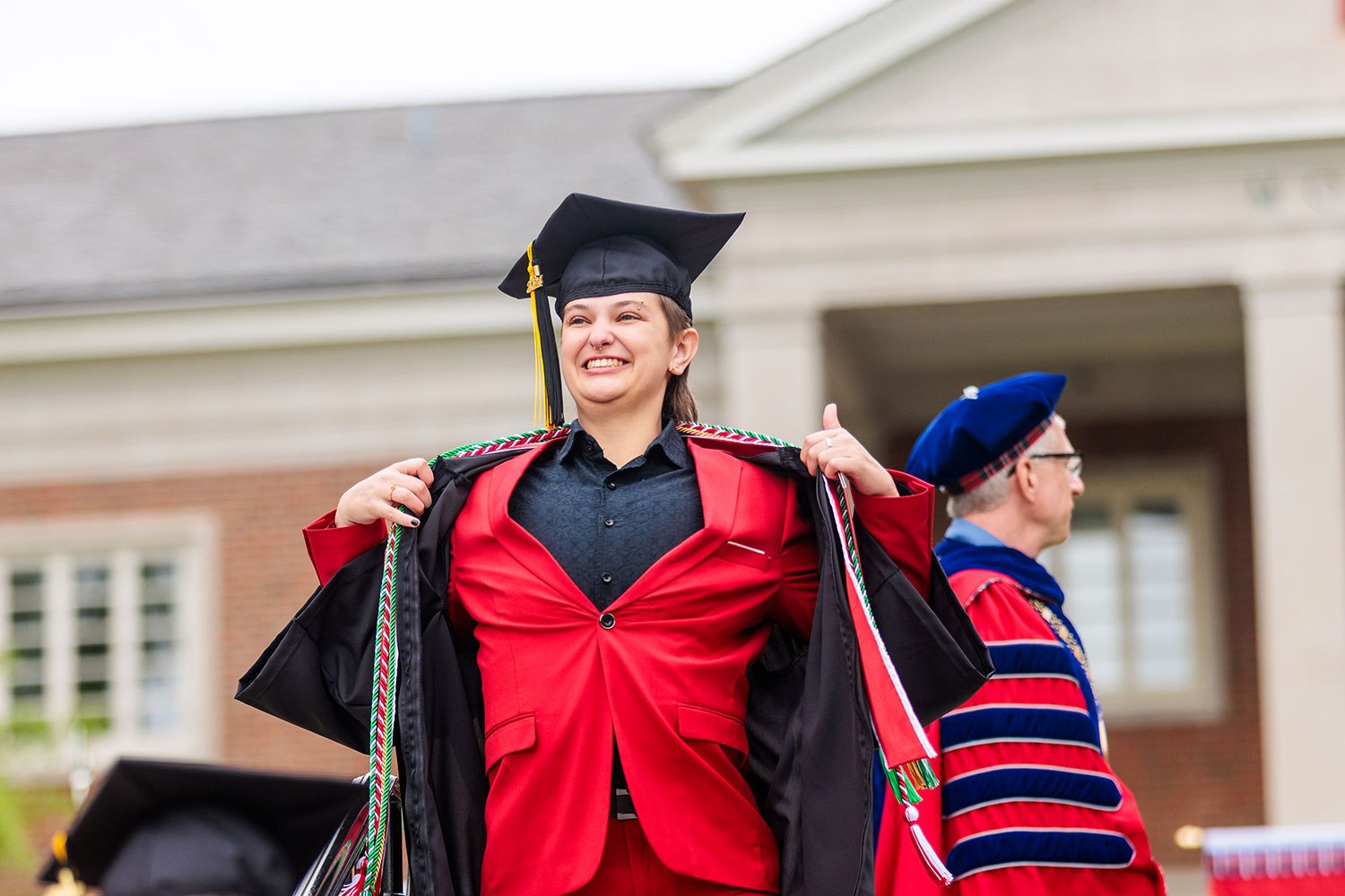 student walking off stage at commencement