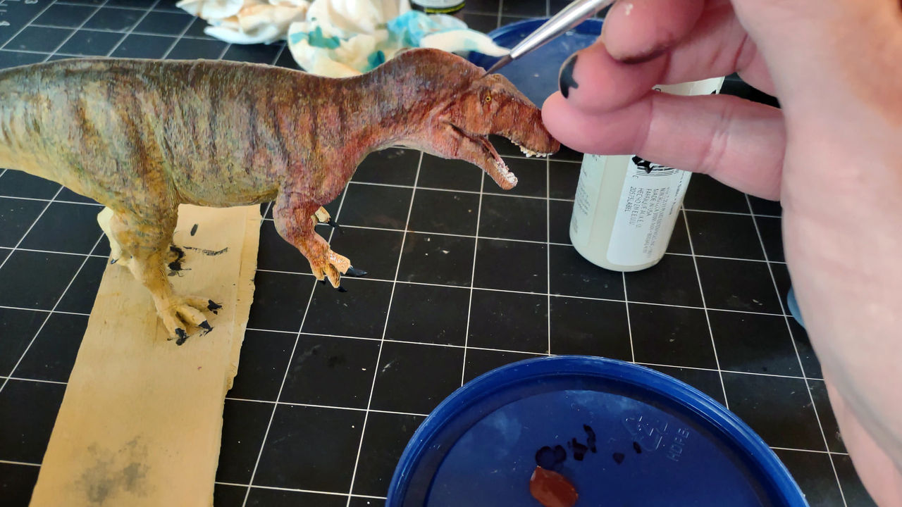 3D-printed dinosaur being painted