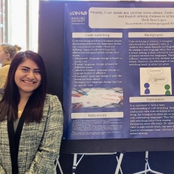 Heidi Ruiz-Lopez explains her research poster at the 2022 winter CARD