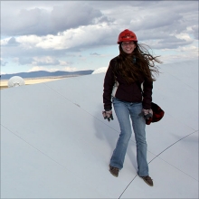 Dr. Sandy Liss on a VLA antenna