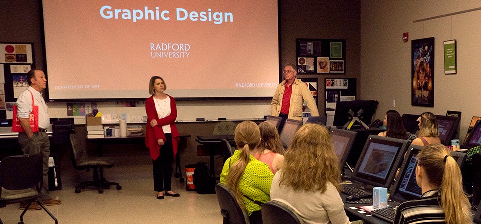 Professor John O'Connor, Director of Advising Donna Oliver, and Professor Ken Smith speak to graphic design students at New River Community College