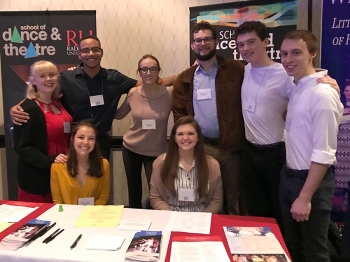 Students pose at the Department of Theatre's table at the VTA conference