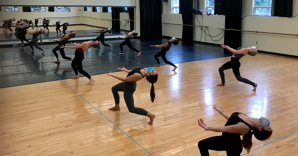 Dance students in Professor Amy Vankirk’s class practice techniques within 10’ taped off areas in the Albig Dance Studio in Peters Hall. 