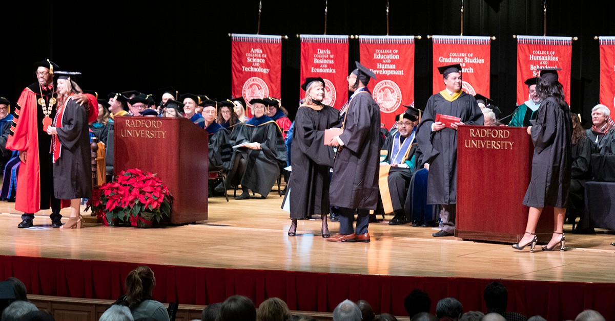 CVPA Dean Margaret Devaney congratulates each graduate during the fall 2019 commencement ceremony. 