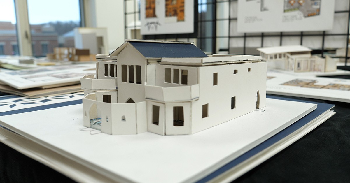 a student building model on display for accreditation review in December 2019