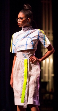 a student models on the catwalk for Fashion Fete 2018