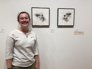 Senior B.F.A. student Kaitlyn Houston poses by her winning artwork.