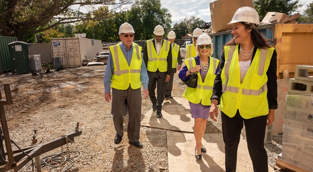 Touring the site, from left: H. Pat Artis, Ph.D.; President Brian O. Hemphill, Ph.D.; Chad Reed, vice president for finance and administration and chief financial officer; Heather Miano ’91, executive director of administration;  Nancy E. Artis ’73, chair of the Radford University Foundation Board of Directors; and Wendy Lowery, vice president for university advancement.