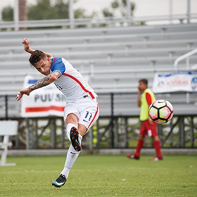 Radford University men's soccer junior Nick Mayhugh kicks the ball during the United States Paralympic games