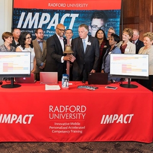 President Hemphill and former Governor Terry McAuliffe mark the beginning of the IMPACT program.