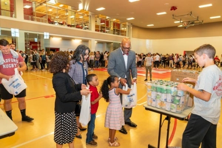 President and First Lady Hemphill with their twins at the 2018 Radford Gives Back canned food drive.  