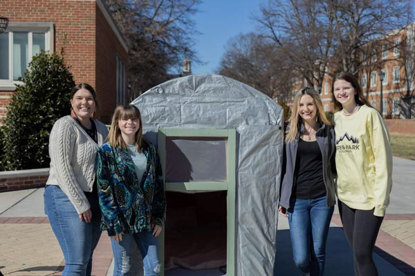 Members of the Design 205 class with their shelter from left to right: Hannah Ferris, Raella Papers, Lora Ellen Robinson, and Grace Sale.