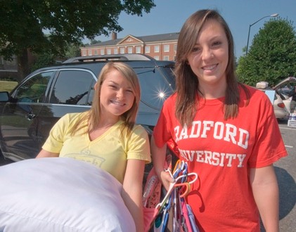 Freshmen Brooklyn Giles and Kelsea Messenger are all smiles as they move into Jefferson Hall. 