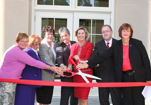 President Penelope Kyle and guests at the COBE ribbon cutting ceremony.