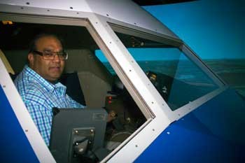 RU Master's Candidate Muhammad Khan in the NASA Langley Research Center's 757 flight simulator 
