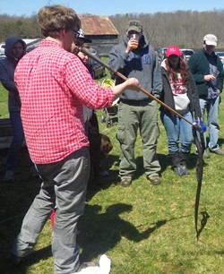 RU Biology Assistant professor demonstrates the proper and humane way to handle snakes. 