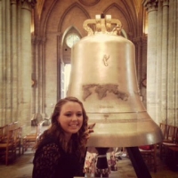 RU nursing student Sperry Grills is shown next the Bell of Peace and Freedom of which she is a godparent. 