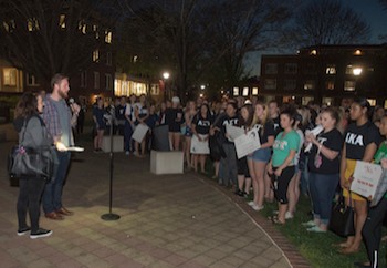 Keynote speaker Tim Mousseau addresses students during the Take back the Night march