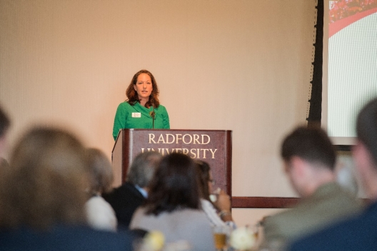 Guest Speaker Lisa Ghiodatti addresses the audience during her remarks to the Alumni Volunteer Leadership Business Lunch and Awards luncheon.