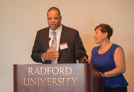 2017 Outstanding Service Award Winners David ’85, M.S. ’87 and Pebbles ’85 Smith give their acceptance remarks after receiving their award at Friday’s Alumni Volunteer Leadership Business Lunch and Awards Ceremony in Kyle Hall.