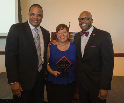 2017 Outstanding Service Award Winners David ’85, M.S. ’87 and Pebbles ’85 Smith with Radford University President Brian O. Hemphill after Friday’s Alumni Volunteer Leadership Business Lunch and Awards luncheon in Kyle Hall.