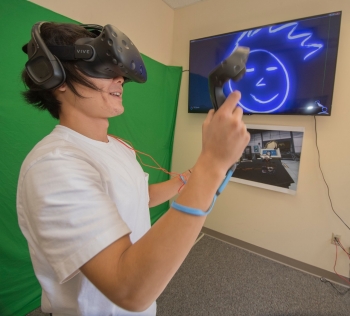Geospatial Science student Daniel Yoon uses virtual reality technology in Radford University's Cook Hall. 
