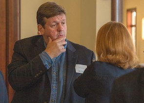 David Ridpath (left), city manager for the City of Radford, speaks with Margaret Devaney (right), dean of the College of Visual and Performing Arts.