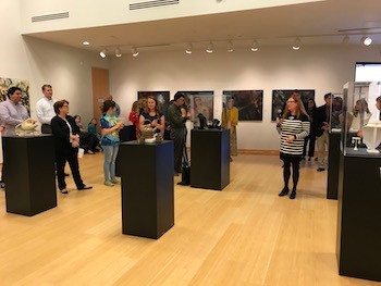 Alison Pack, associate professor of Metalsmithing and Jewelry Design, welcomes the crowd at the opening reception for the BFA Studio Graduation Exhibition on April 20.