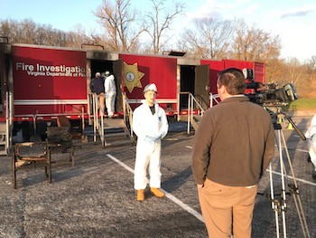 Nick Brown talks with the media during the arson investigation exercise.
