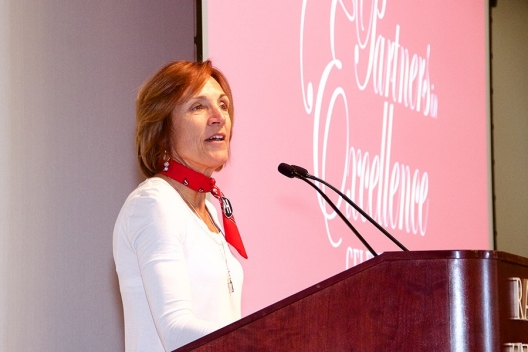 Anita Williams gives an emotional speech during the Partners in Excellence Celebration