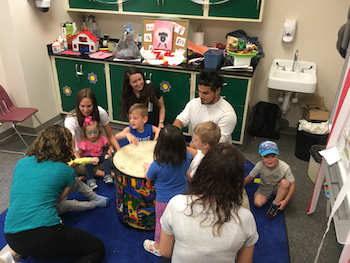 Music Therapy students work with children in the Preschool Language Lab