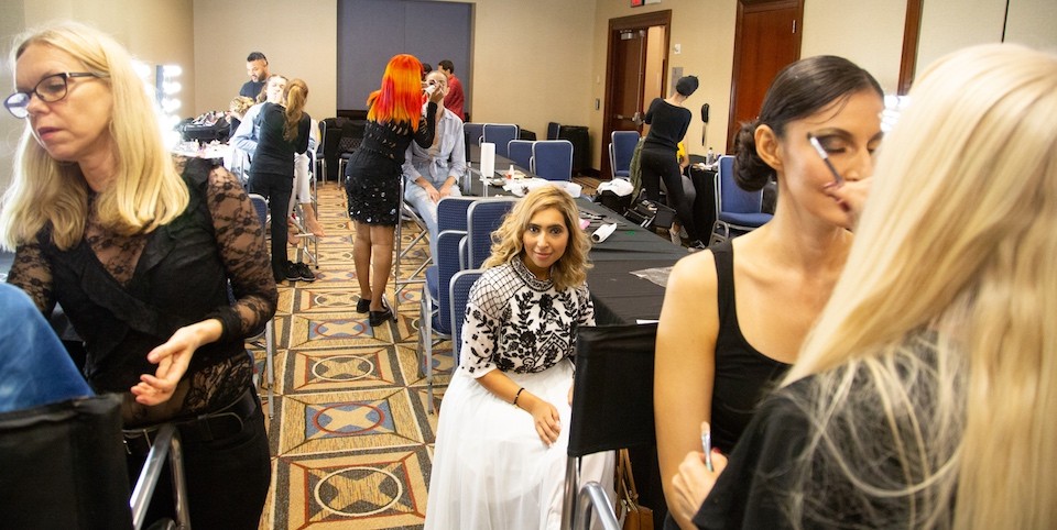 Alghamdi watches her models have their makeup done prior to Couture Fashion Week.